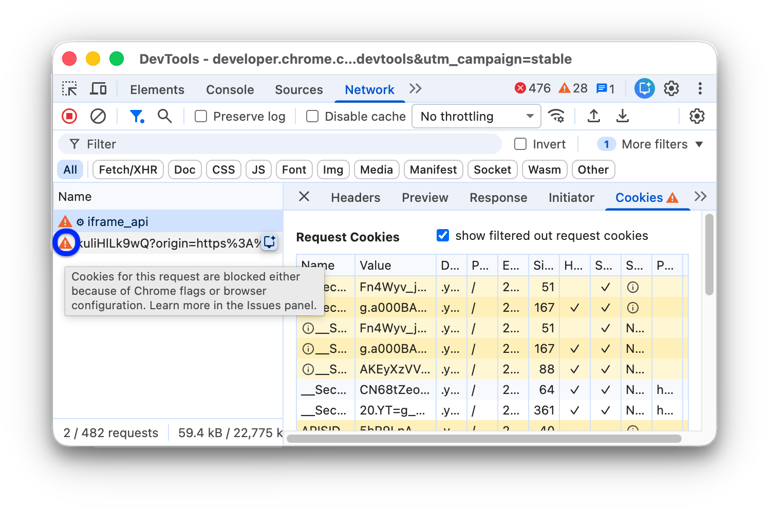 Warning icons next to a request blocked by Chrome flags or configuration.